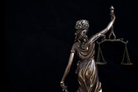 Lady Justice big statue in law on black backdrop. Law and justice conceptの写真素材