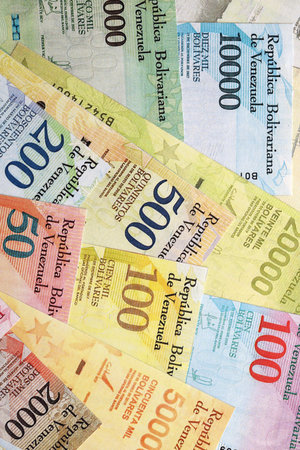 Venezuelan Bolivar currency money bills in big amount. Heap of VED currency banknotes with different denomination close upの写真素材
