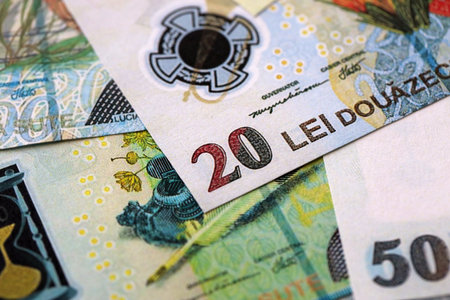 Romanian Leu currency money bills. RON currency banknotes in heap with different denomination close...