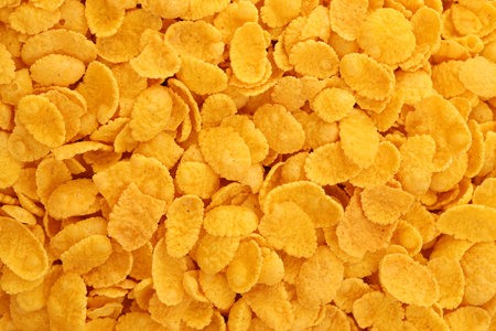 Corn flakes background texture close up. Top view cornflake cereal box for morning breakfast