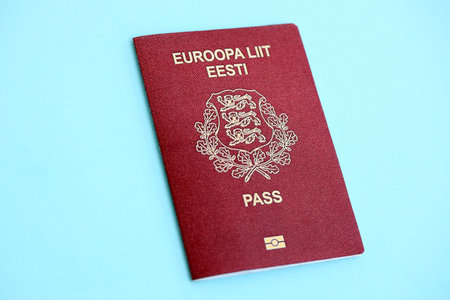 Estonia passport on light blue paper background close up. Citizenship and travel in Europe conceptの写真素材