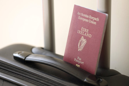 Ireland passport on touristic baggage luggage in airport close up. Travel and tourism in Europe conceptの写真素材