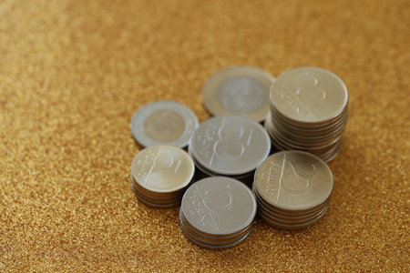 Many Hungarian forint coins in big pile close up. Forint is an official Hungarian currency instead...