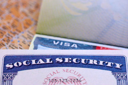 The visa in a blurred passport page background and social security number personal document. SSN - social security number for live in USAの写真素材