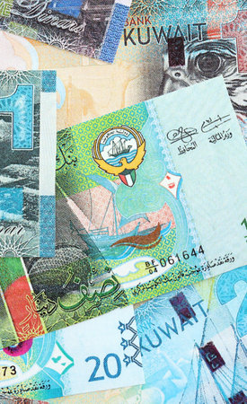 Kuwaiti dinar currency money bills. The current banknotes lies on table in big amount close up