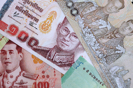 Thai baht currency money. The current banknotes lies on table in big amount close up