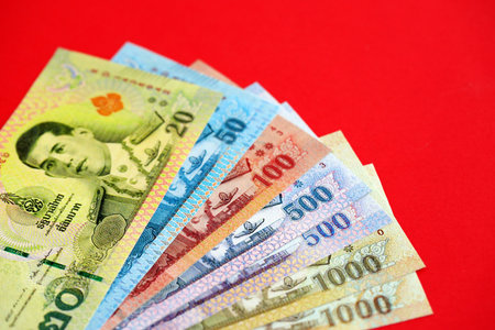 Thai baht money bills in big amount on red close up. Finance and banking conceptの写真素材