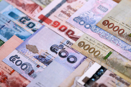 Thai Baht currency money bills. THB currency banknotes in pile with different denomination close upの写真素材