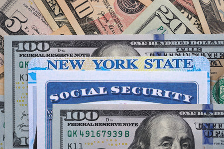 Social security number and New York driving license with US dollar money bills close upの写真素材
