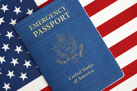 United States emergency passport book on US flag close up. Travel document on official banner photoの写真素材