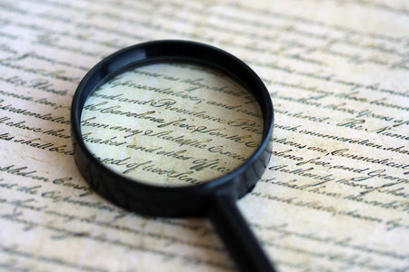 Magnifying glass and United States Constitution. American USA Constitution paper page and loupe close upの写真素材