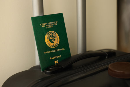 Nigerian passport on travel luggage close up. The concept of travel and vacationの写真素材
