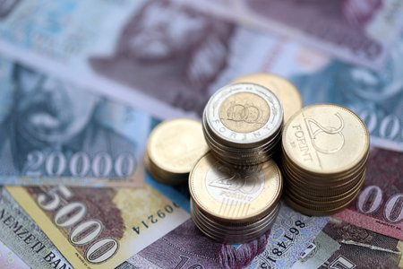 Pile of Hungarian Forint currency money bills and coins. HUF currency banknotes and coins close upの写真素材