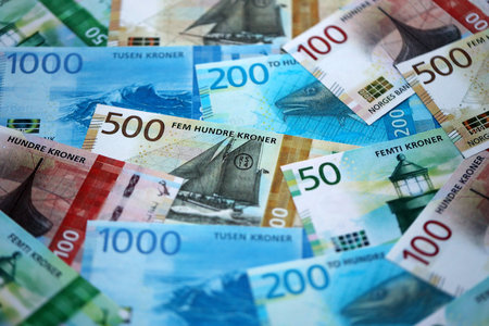 Norwegian Krone currency money bills. NOK currency banknotes in pile with different denomination close upの写真素材