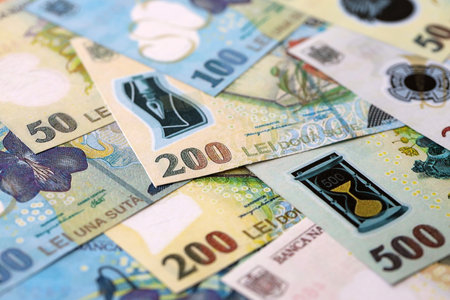 Romanian Leu currency money bills. RON currency banknotes in stack with different denomination close...