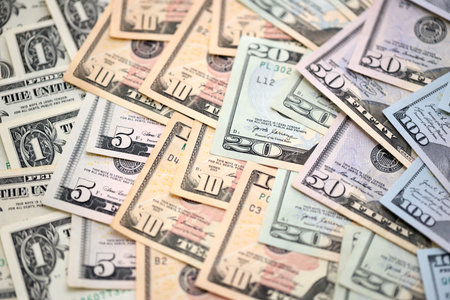 United States Dollar currency money bills. USD currency banknotes in pile with different denomination close upの写真素材