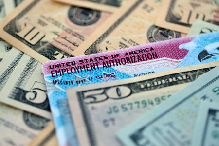 American US dollars money bills with employment authorization card close upの写真素材