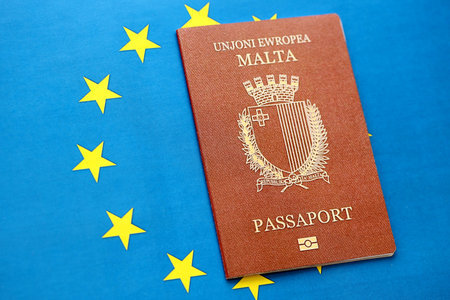 Malta passport on European union blue flag background close up. Citizenship in countries of Europe conceptの写真素材
