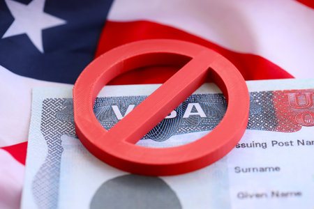 Visa Ban Concept. United States of America visa on passport page with prohibition sign close upの写真素材
