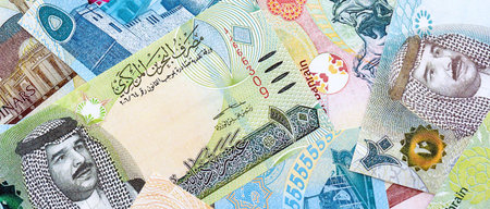 Bahraini dinar currency money bills. The current banknotes lies on table in big amount close up