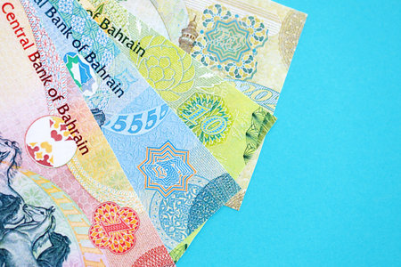 Bahraini dinar money bills in big amount on blue close up. Finance and banking concept