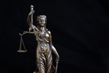 Lady Justice female statue in law on black backdrop. Law and justice conceptの写真素材