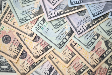 United States Dollar currency money bills. USD currency banknotes in pile with different denomination close upの写真素材