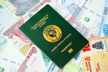 Nigerian naira currency money bills and passport close up. The concept of travel and vacation