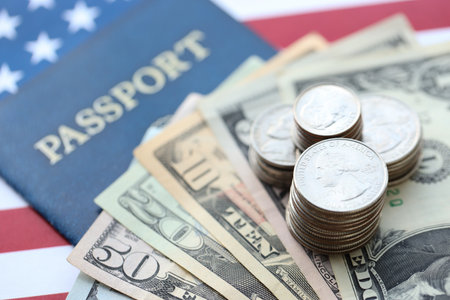 American US dollars money bills and passport with american flag close up. Travel across United States of America conceptの写真素材