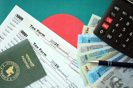 Bangladeshi taka money bills in big amount lies on table with pen, calculator, passport and tax forms close up. Finance and banking conceptの写真素材
