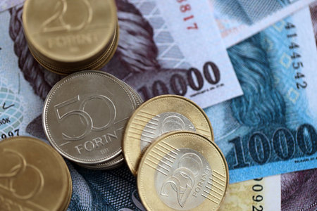 Heap of Hungarian Forint currency money bills and coins. HUF currency banknotes and coins close upの写真素材