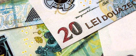 Romanian Leu currency money bills. RON currency banknotes in heap with different denomination close...