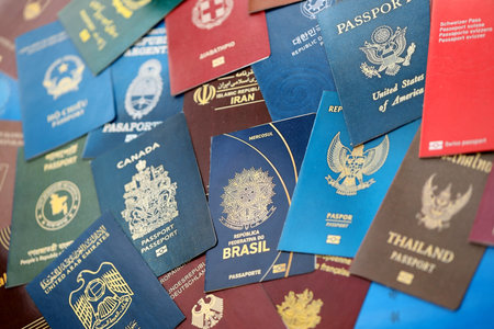 Big amount of biometrical passports from various different countries close upの写真素材