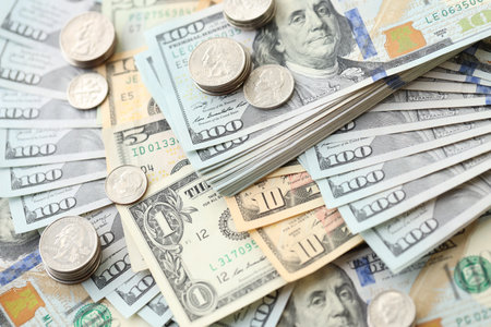 American US dollars money bills and coins close up in big amount. Financial concept