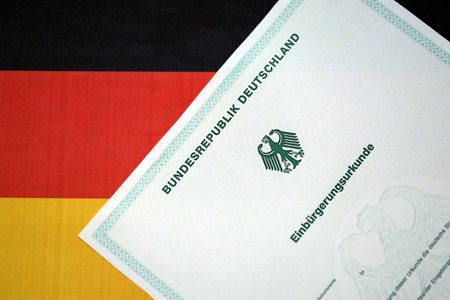 German official naturalization certificate. Symbolic for successful acquisition of German citizenship close upの写真素材