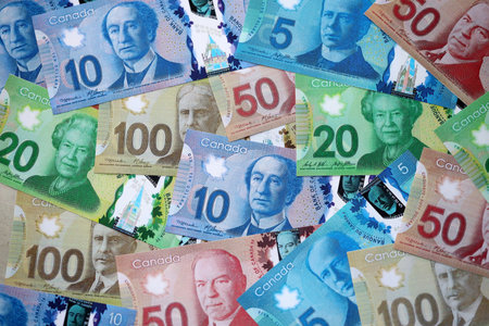 Canadian Dollar currency money bills. CAD currency banknotes in big stack with different denomination close upの写真素材