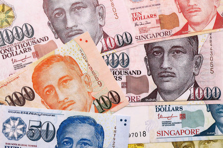 Singapore Dollar currency money bills. SGD currency banknotes in big amount with different...