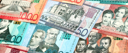 Dominican Republic Pesos currency money bills. DOP currency banknotes in bunch with different...