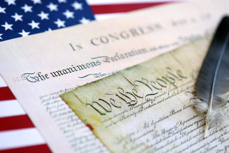 United States Bill of Rights Preamble to the Constitution and American Flag close up
