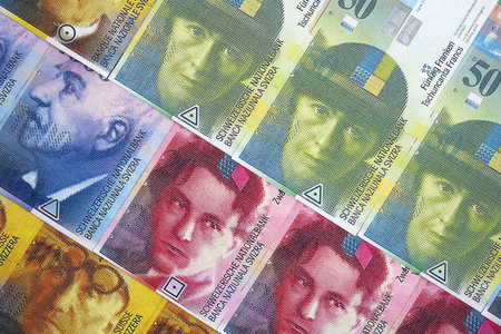 Swiss franc banknotes. The current francs money bills lies on table in big amount close up. The concept of business and investment in Switzerlandの写真素材