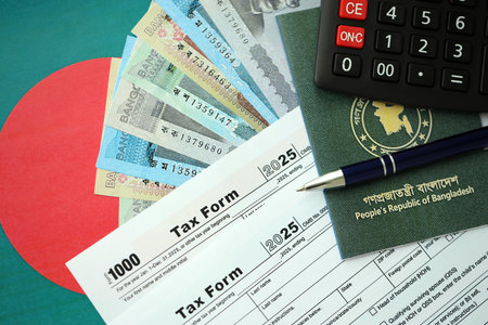 Bangladeshi taka money bills in big amount lies on table with pen, calculator, passport and tax forms close up. Finance and banking conceptの写真素材