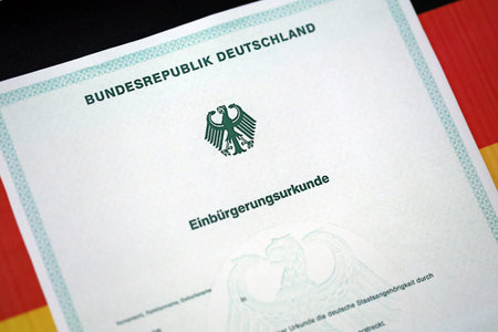 German official naturalization certificate. Symbolic for successful acquisition of German citizenship close upの写真素材