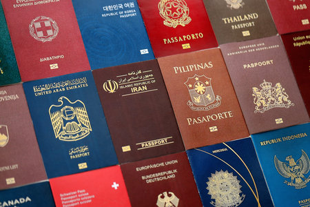 Big amount of biometrical passports from various different countries close up
