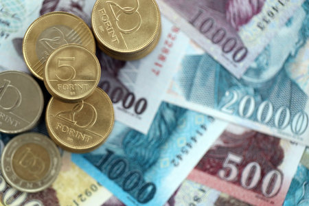 Heap of Hungarian Forint currency money bills and coins. HUF currency banknotes and coins close upの写真素材