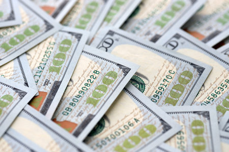 United States Dollar currency money bills. USD currency banknotes in big amount with different...