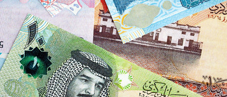 Bahraini dinar currency money bills. The current banknotes lies on table in big amount close up