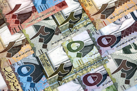 Saudi Arabia riyal money bills banknotes lies in big pile on table close up. Concept of finances and business in Saudi Arabiaの写真素材
