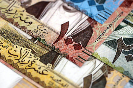 Saudi Arabia riyal money bills banknotes lies in big pile on table close up. Concept of finances and business in Saudi Arabiaの写真素材