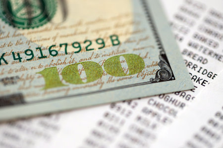 Money lose change after store visit with the store receipt. Supermarket check receipt and one...