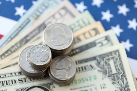 American US dollars money bills and on American flag close up. Money investment concept and taxpayingの写真素材